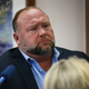 In this Aug 3, 2022 file photo, conspiracy theorist Alex Jones attempts to answer questions about his emails during trial at the Travis County Courthouse in Austin. An attorney representing two parents who sued Jones over his false claims about the Sandy Hook massacre says the U.S. House Jan. 6 committee has requested two years’ worth of records from Jones’ phone. Attorney Mark Bankston said in court Thursday, Aug. 4, 2022 that the committee investigating the attack on the U.S. Capitol has requested the digital records.